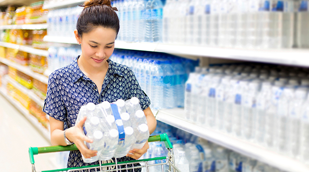 Young woman shopping for bottled water