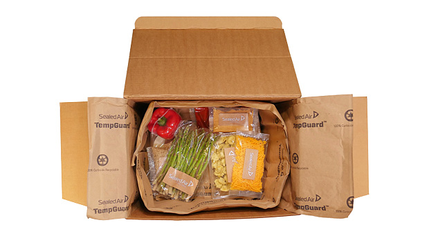 Shipping box of food with paper cushioning