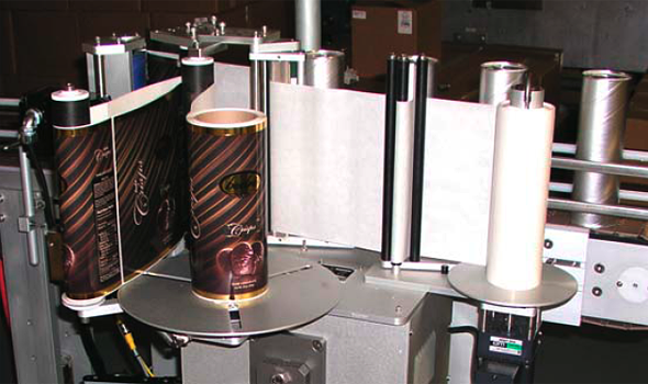 Wrap Around Inline Canister Labeling System
