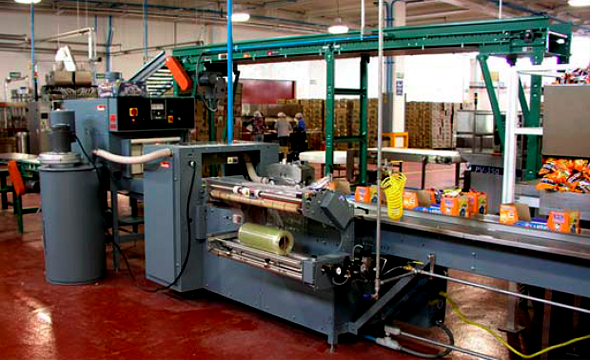 Trays Are Automatically Formed, Conveyed, Loaded, and Shrink Wrapped